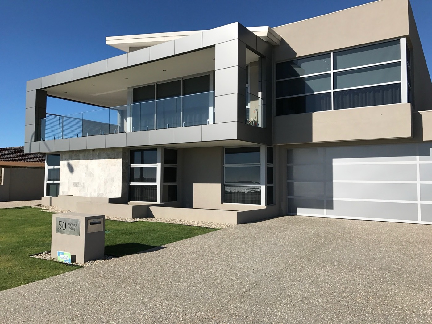 Arcadia Drive Shoalwater residence with a deep balcony and metal-clad façade