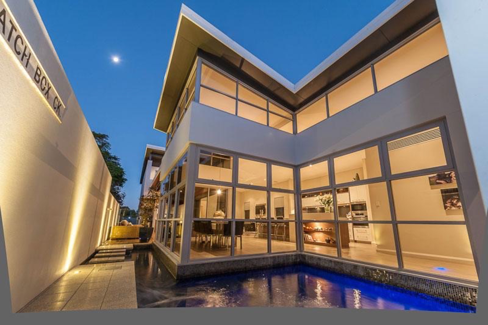 East Fremantle residence around its blue-lit water courtyard