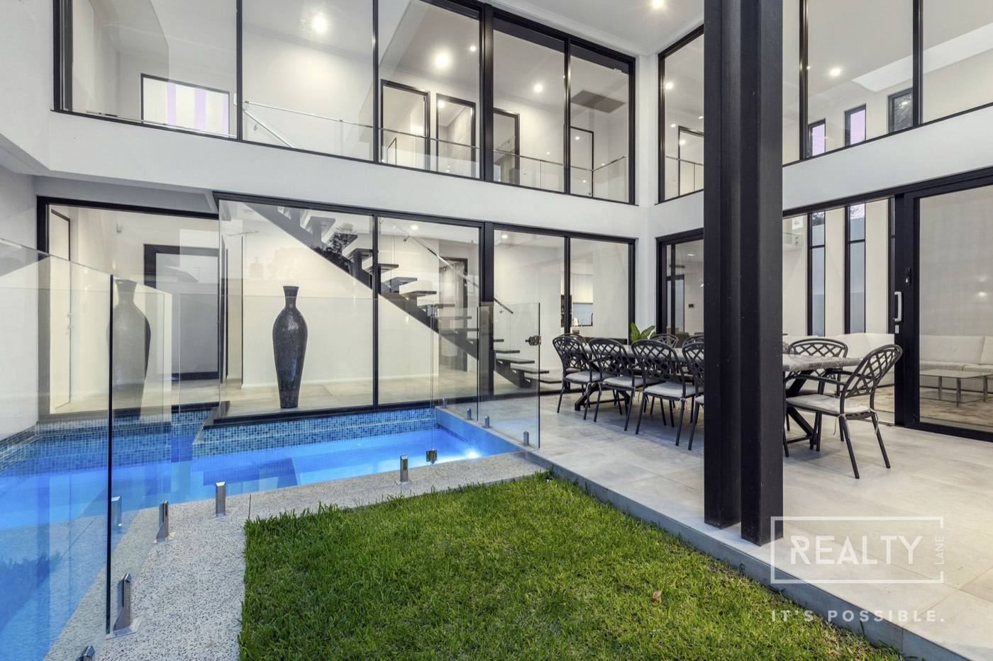 Marine Terrace courtyard pool and double-height glazed interior