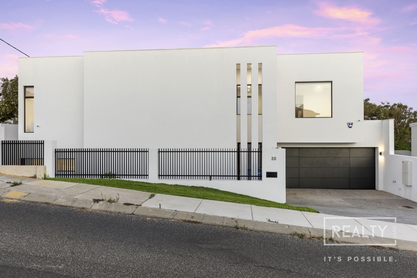 Marine Terrace Sorrento residence with its clean white street facade and dark gate